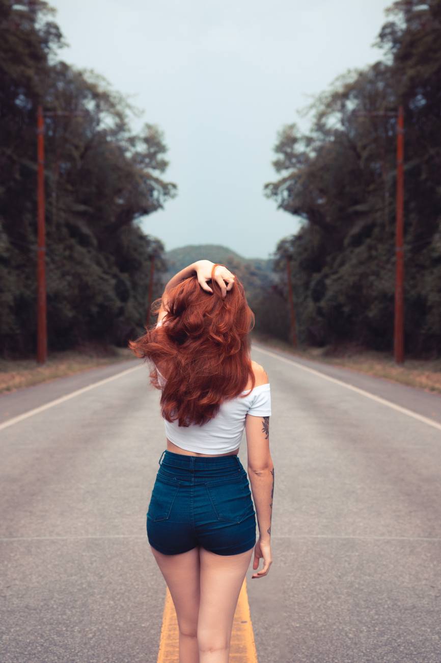 woman standing on road