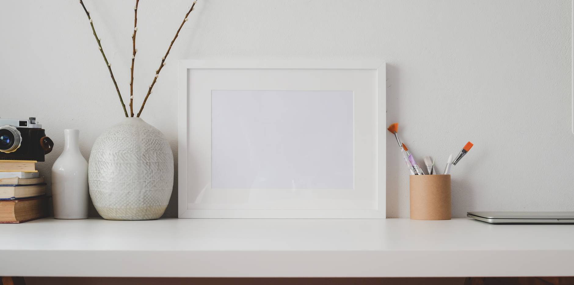 white wooden frame on white flat board