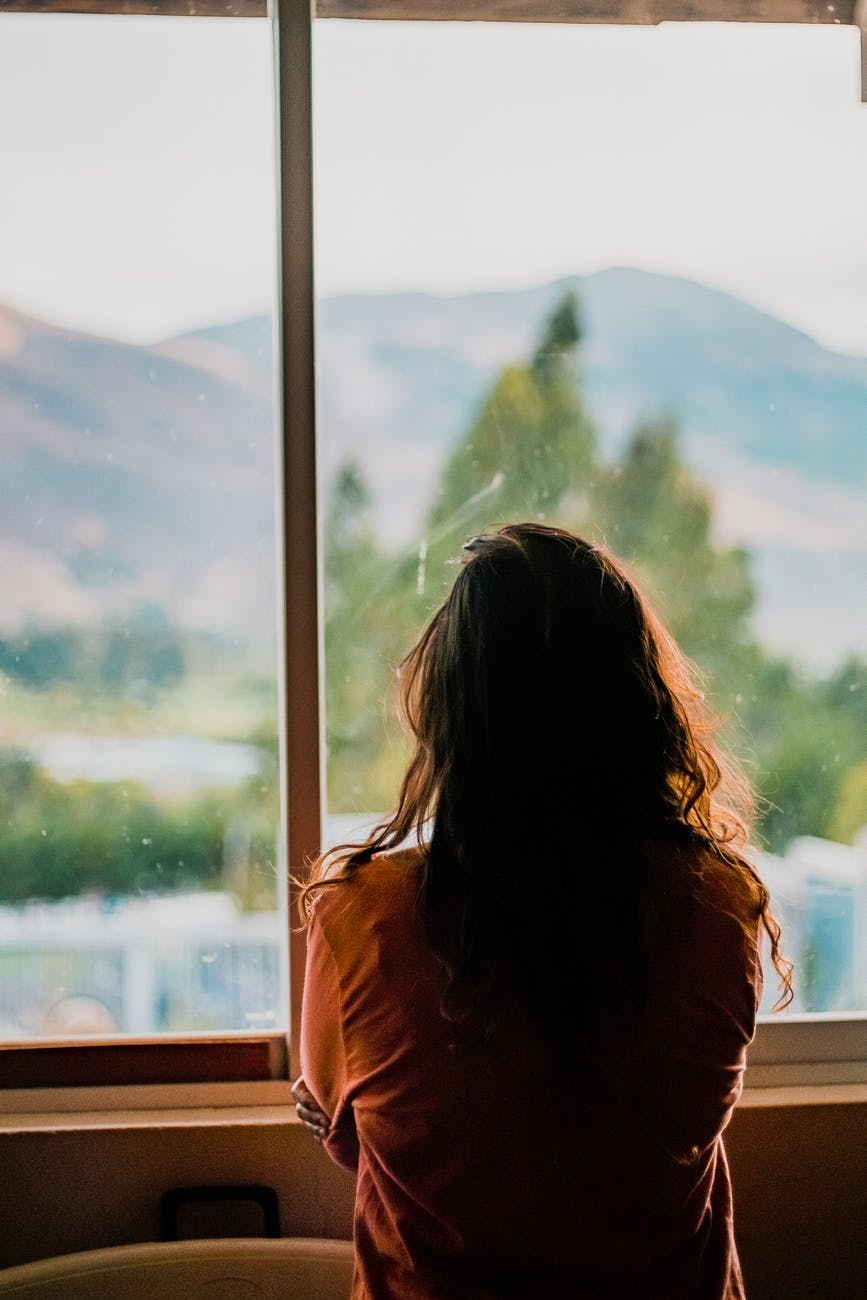 woman wearing brown shirt inside room